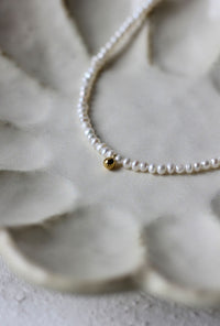 Petite Studio's Tiny Pearl Necklace